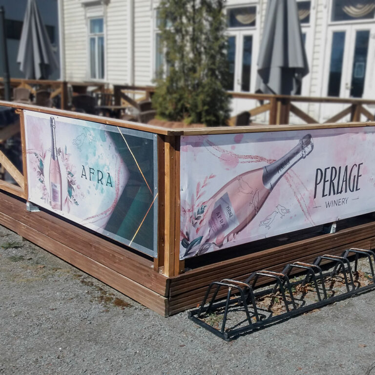 a sign on a wooden railing